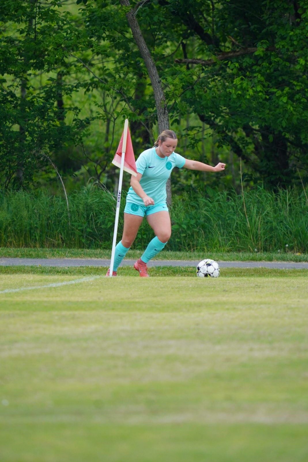 AH United player taking corner kick